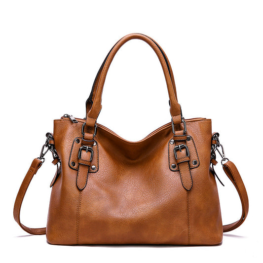 Vintage PU leather tote bag front view with dual handles and shoulder strap.