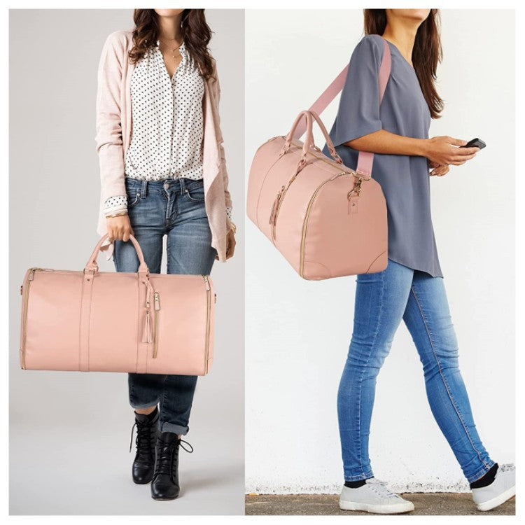 Two people holding pink duffel bags against a neutral background